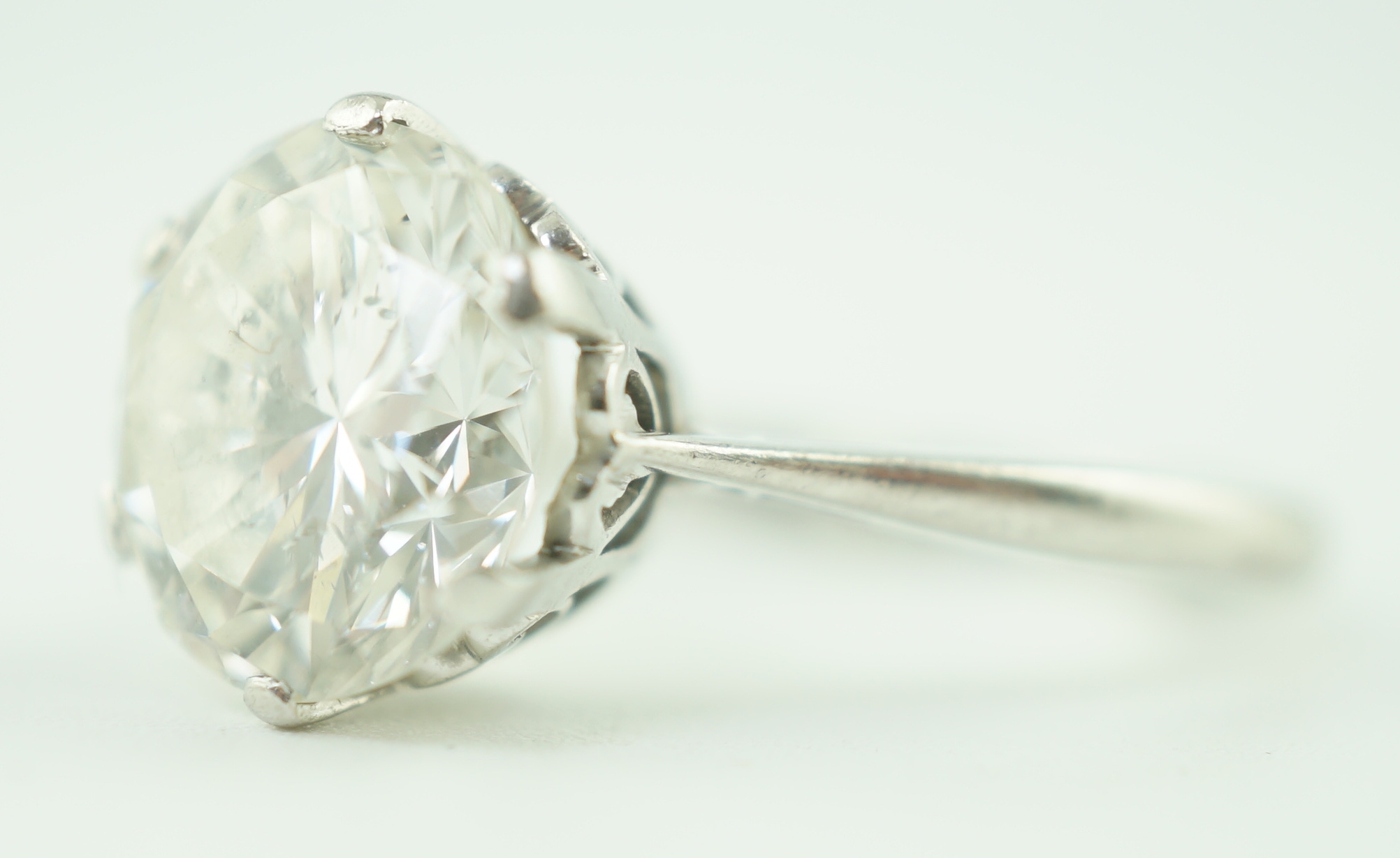 A mid 20th century platinum and solitaire diamond set ring